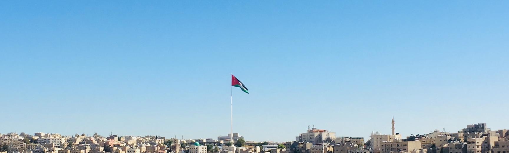 Image of Amman with Jordan flag flying high