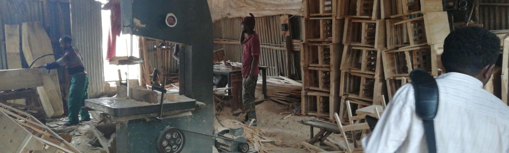 Men working in a messy factory in Addis Ababa