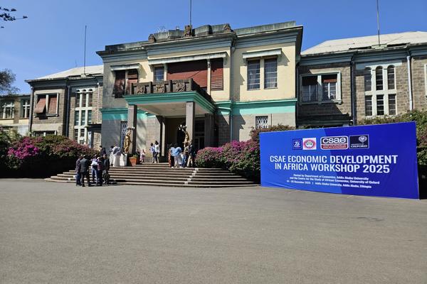 Photo of CSAE Workshop 2025 banner outside hall at Addis Ababa University