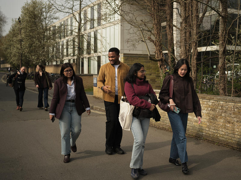 CSAE students walking outside the Manor Road Building in Oxford