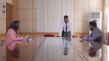 Three people in an office room