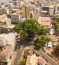 City intersection with a tree in the centre in Freetown, Sierra Leone