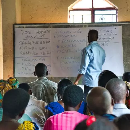 People attend an agriculture training session in Western Uganda