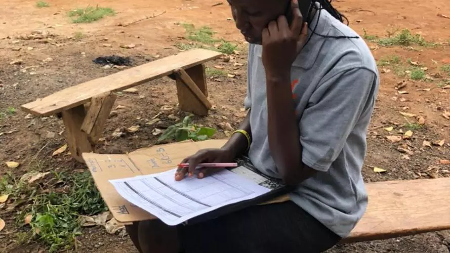 Photo of girl in Botswana on the phone