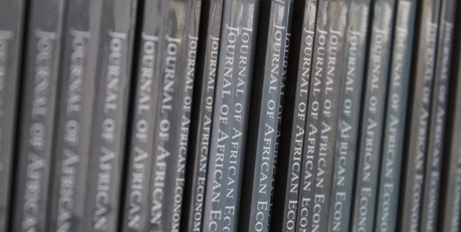 Shelf of hard copies of the Journal of African Economies