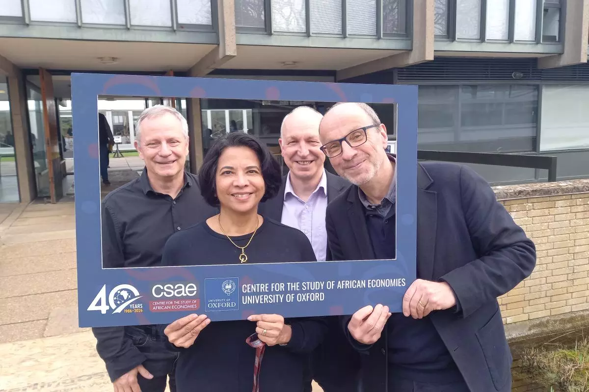 Photo of John Hoddinott, Pramila Krishnan, Chris Adam and Stefan Dercon in the 40th anniversary fram in 2026