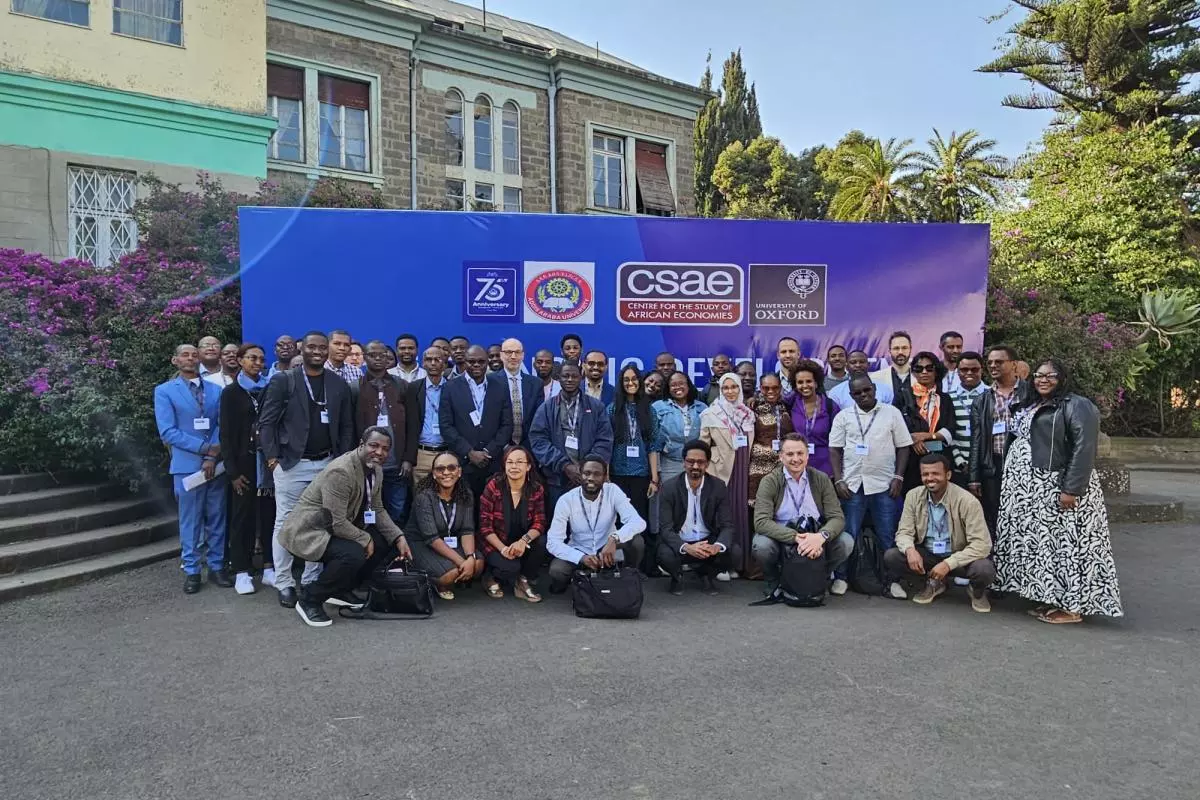 Large group of participants gather in front of the workshop banner at Addis Ababa University, Ethiopia